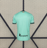 Camiseta Alavés 26-27 tercera equipación vista trasera en verde agua con mangas cortas y ribetes negros