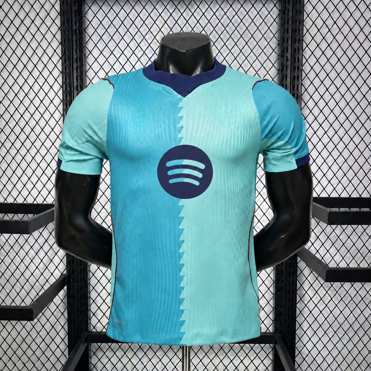 Camiseta Barcelona 26-27 tercera equipación Player vista frontal en verde agua y turquesa con cuello azul marino y ribetes rojos