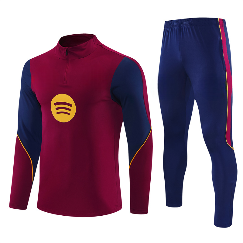 Chándal Barcelona 26-27 Modelo 3 con sudadera granate de media cremallera y pantalón azul con detalles laterales granates y amarillos