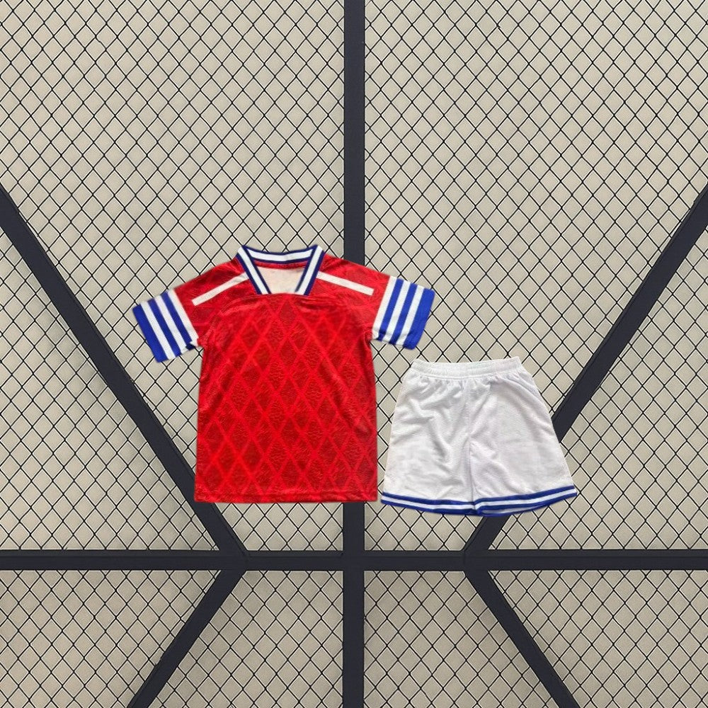 Equipación RCD Espanyol 26-27 visitante infantil con camiseta roja de patrón geométrico y pantalón corto blanco con detalles azules
