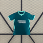 Vista frontal de la camiseta Brighton 26-27 3ª equipación en verde azulado con cuello, puños y paneles laterales en tono menta