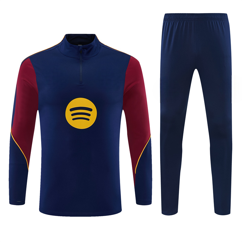Vista frontal del chándal Barcelona 26-27 Modelo 5 con top azul marino de cuello alto y pantalón azul a juego