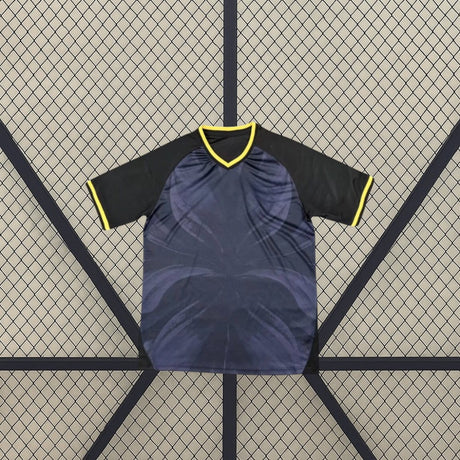 Maglia Giordania 26-27 tercera completo calcio bambino vista frontale en nero y azul oscuro con dettaglios giallos